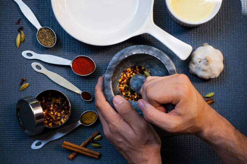 grinding spices with a mortar and pestle