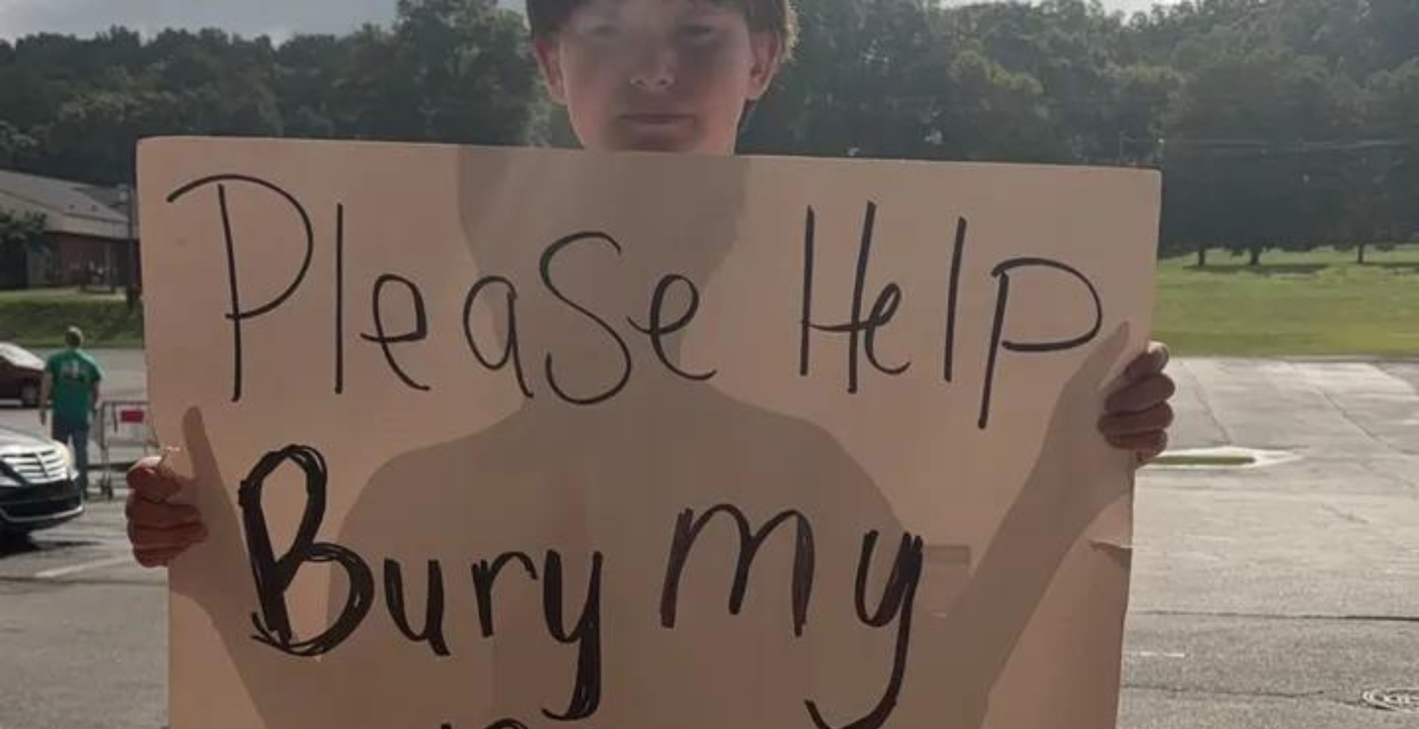 Georgia Boy Holds Heartbreaking Sign Asking For Donations To Help Bury His Mother