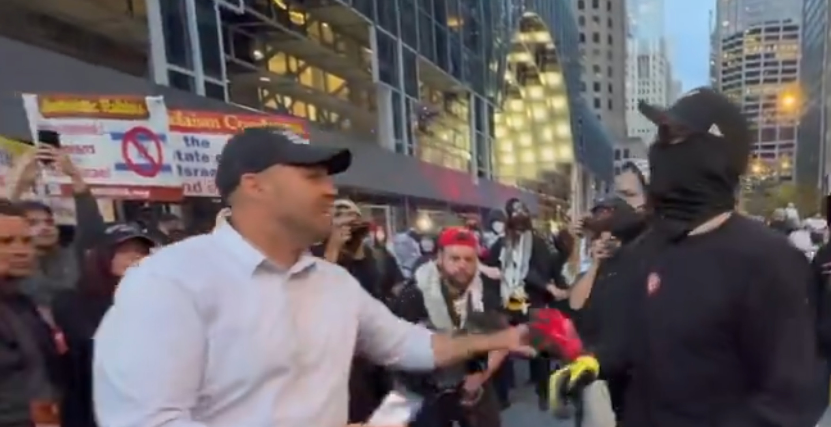 Man Tries To Save American Flag From Burning At Protest Near DNC