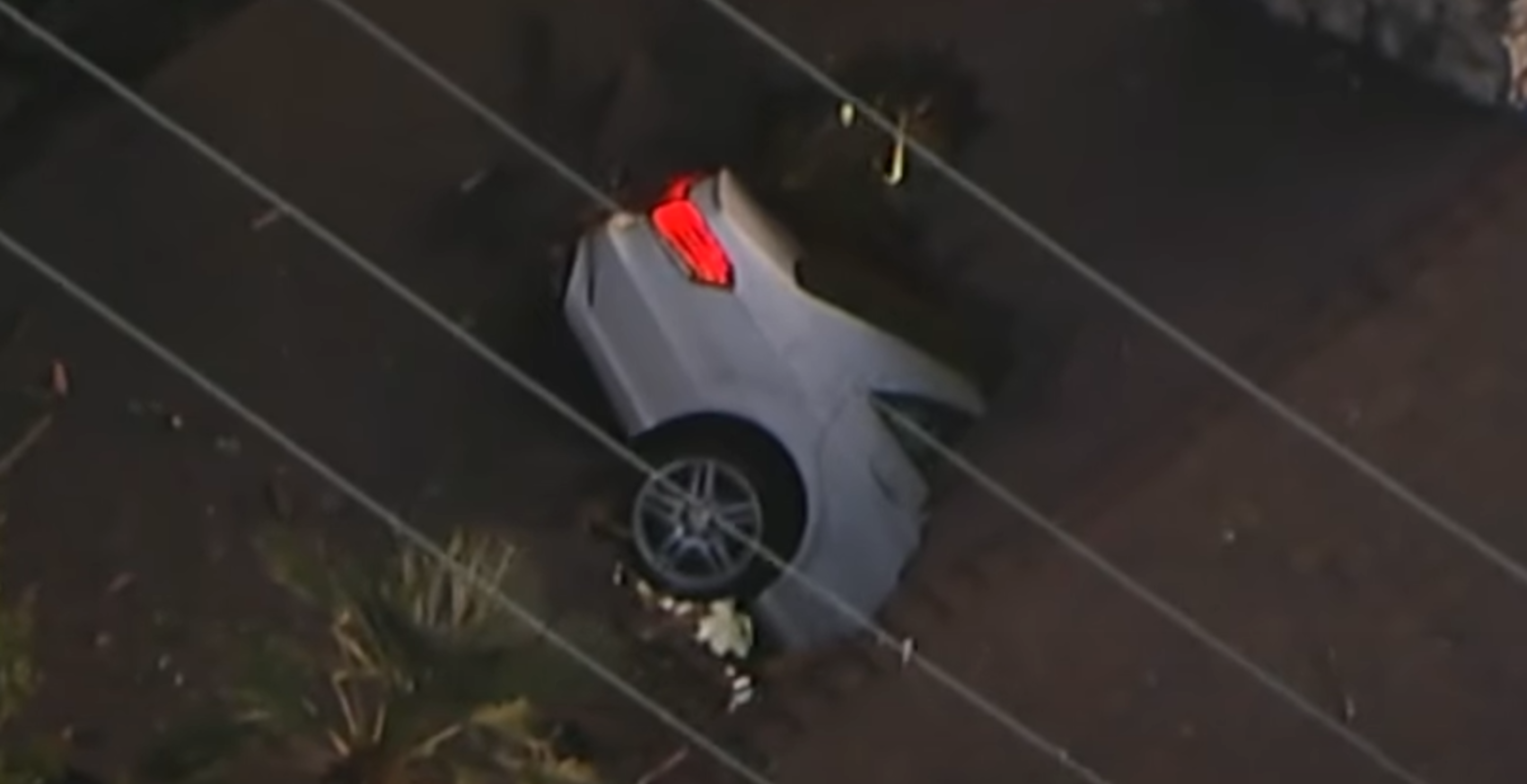 car crashes through roof