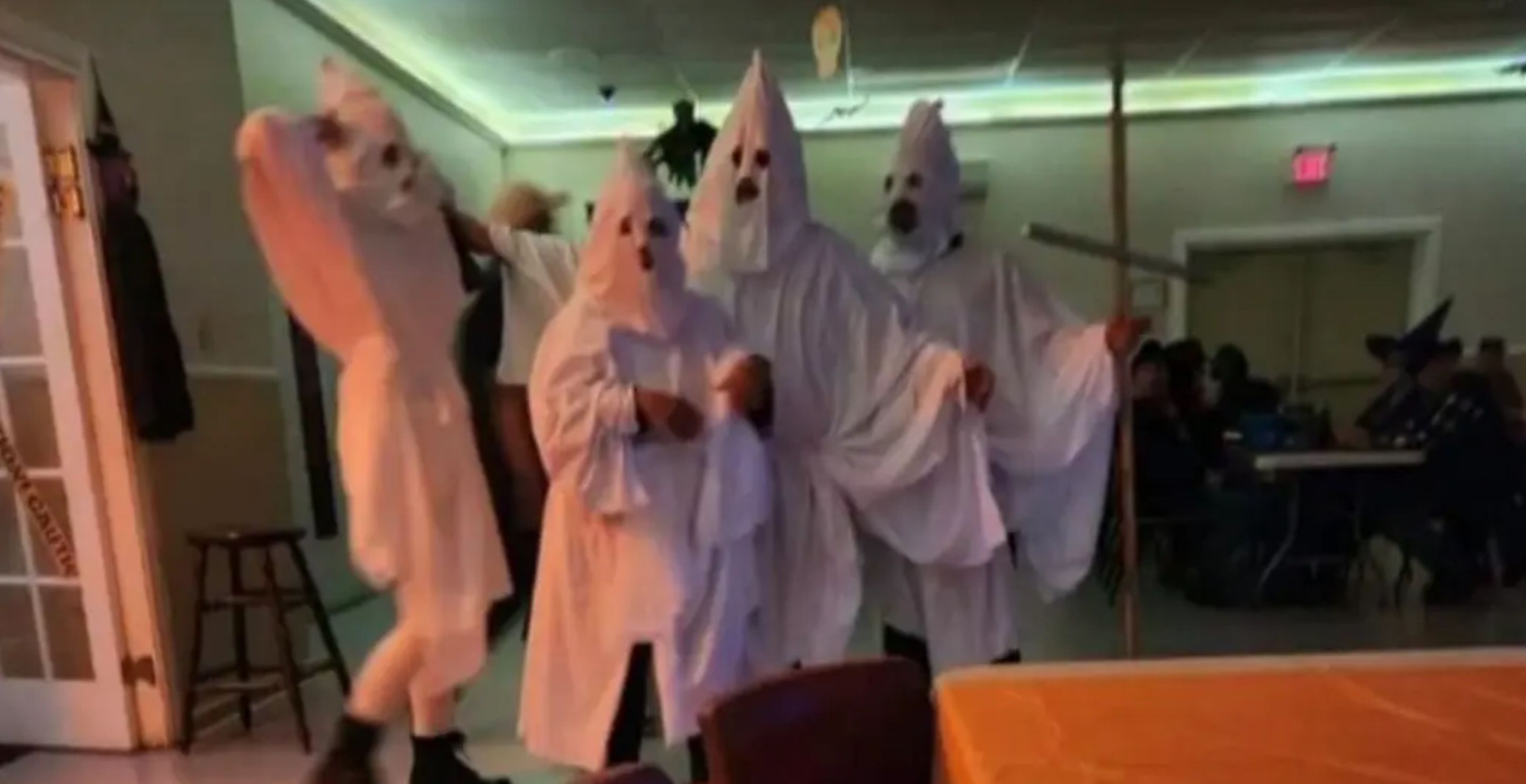 people dressed as kkk attend firefighters party